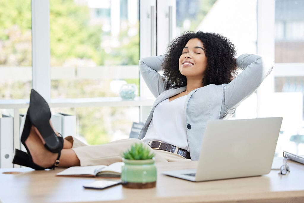 World Star Manpower - Business,Woman,,Feet,Up,And,Relax,With,Laptop,On,Office